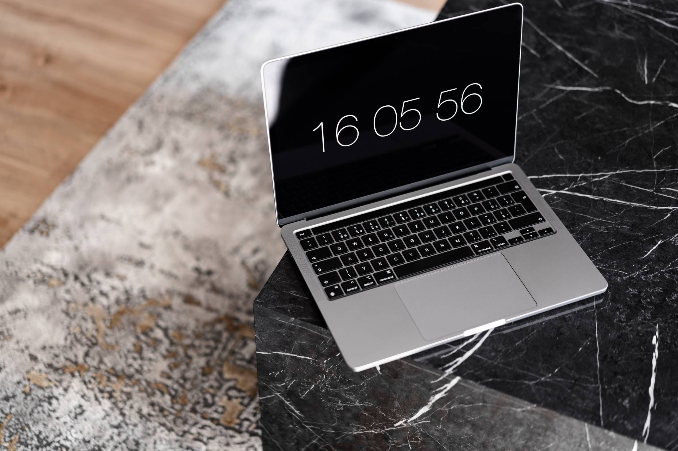 open-laptop-on-a-luxury-marble-coffee-table-free-photo.jpg