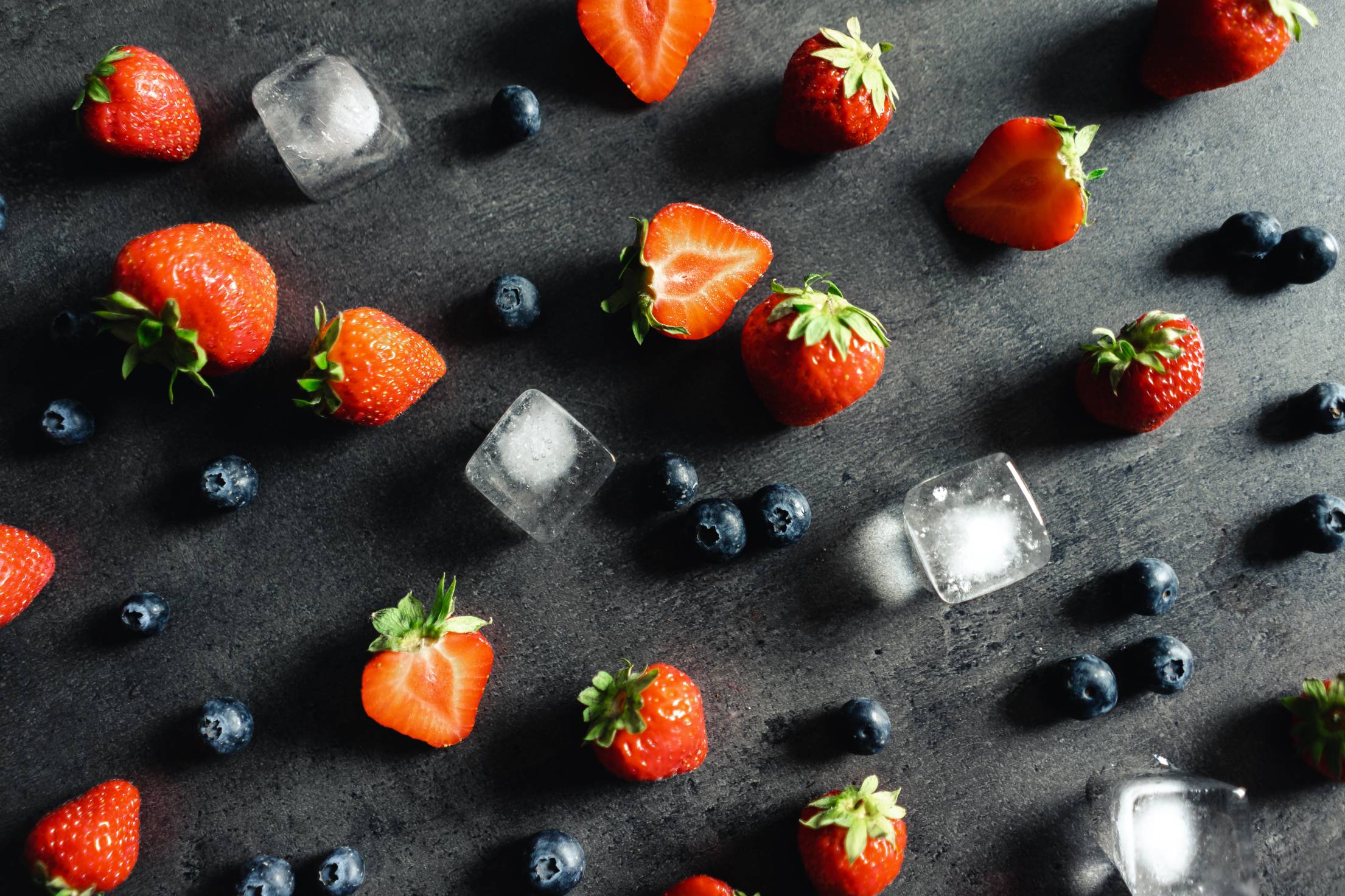 strawberries-and-blueberries-flat-lay-on-a-dark-background.jpg