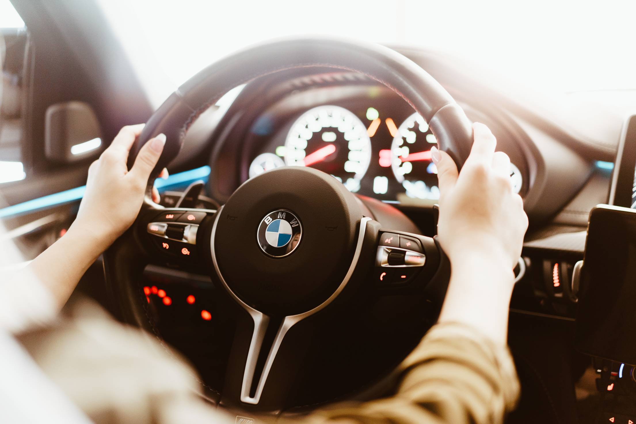 woman-driving-a-bmw-luxury-car-free-photo.jpg